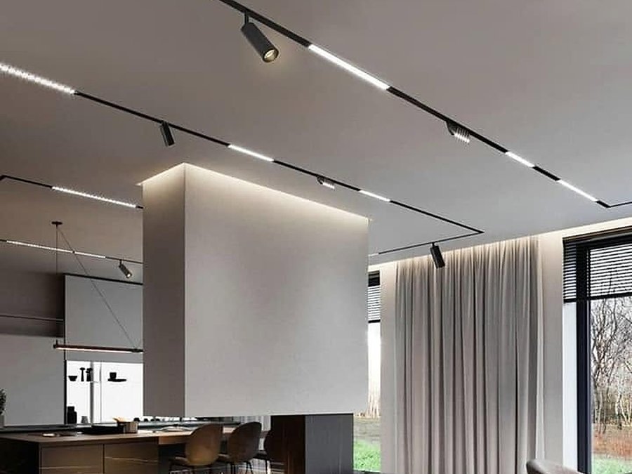 Living room: A loop around the ceiling, spots aimed at the fireplace wall.